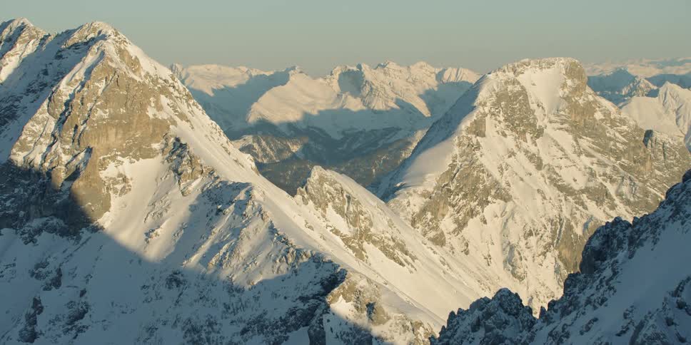 Snow covers tall mountains