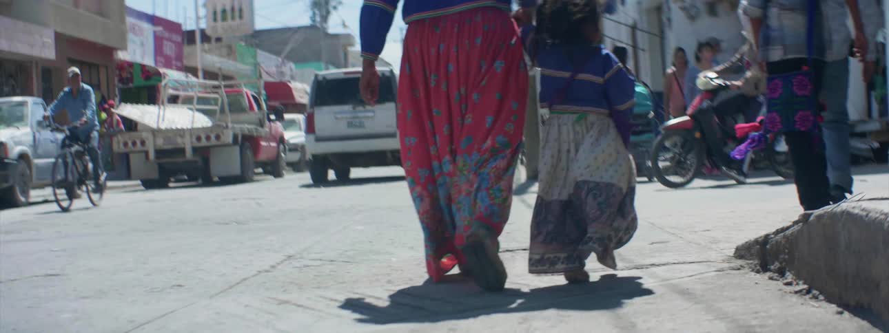 People are walking down the street together