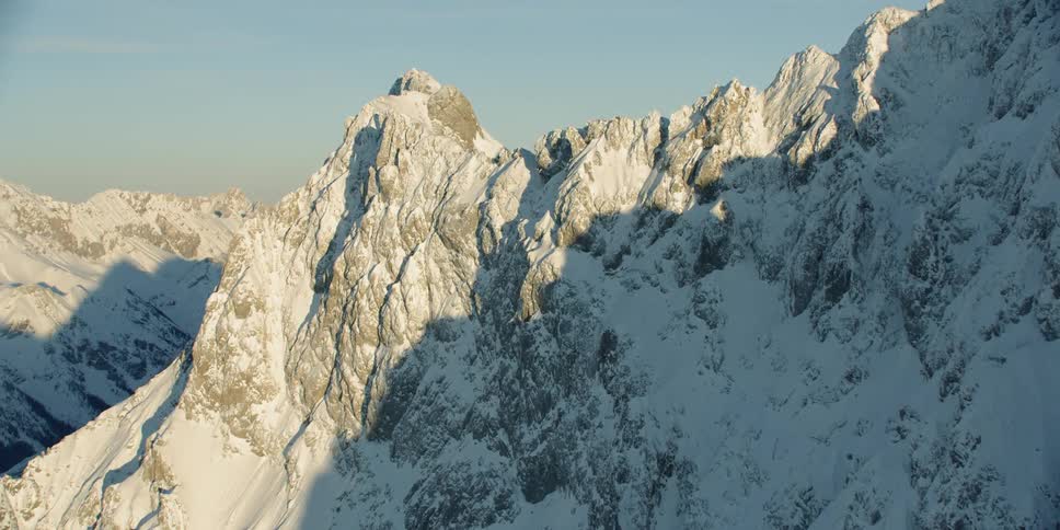 Snow covers the stone mountain