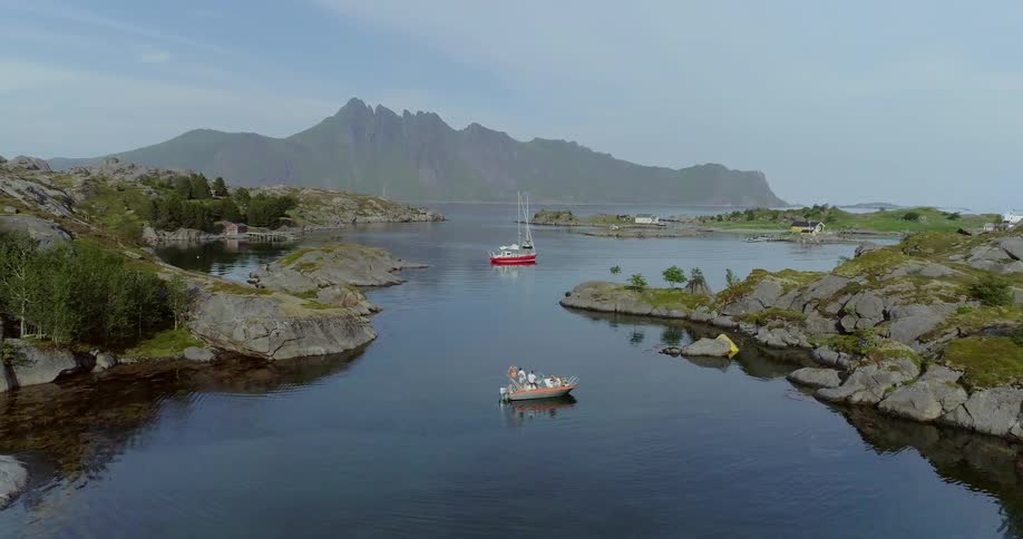 Boats float on a mountain lake