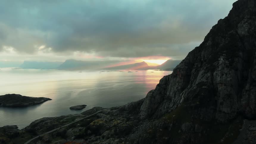 The sun sets over a mountain lake