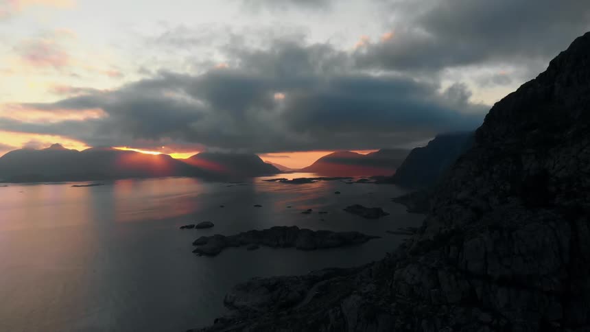 The sun sets over a mountain lake