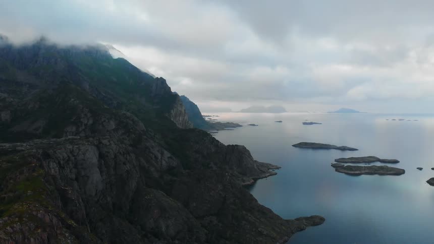 Clouds float above a mountain lake