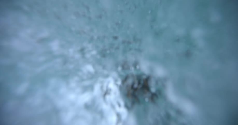 Bubbly blue water swirling around