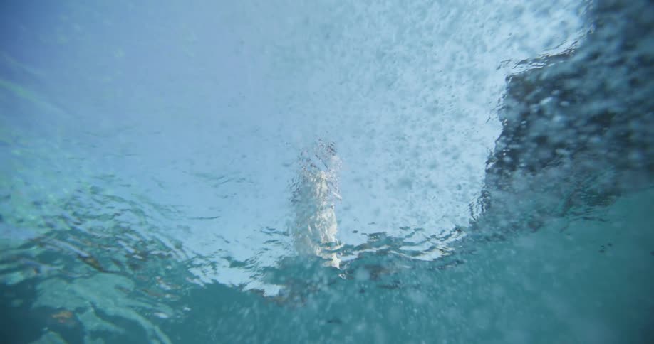 Underwater view looking up at the surface