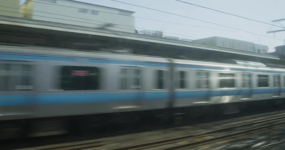 Trains travel on tracks through a busy city