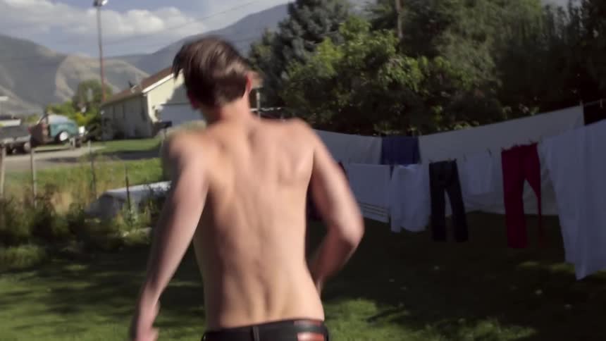 Man running in a grass yard