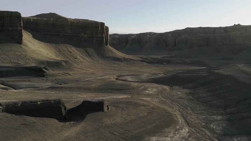 Sandy desert with tall plateaus