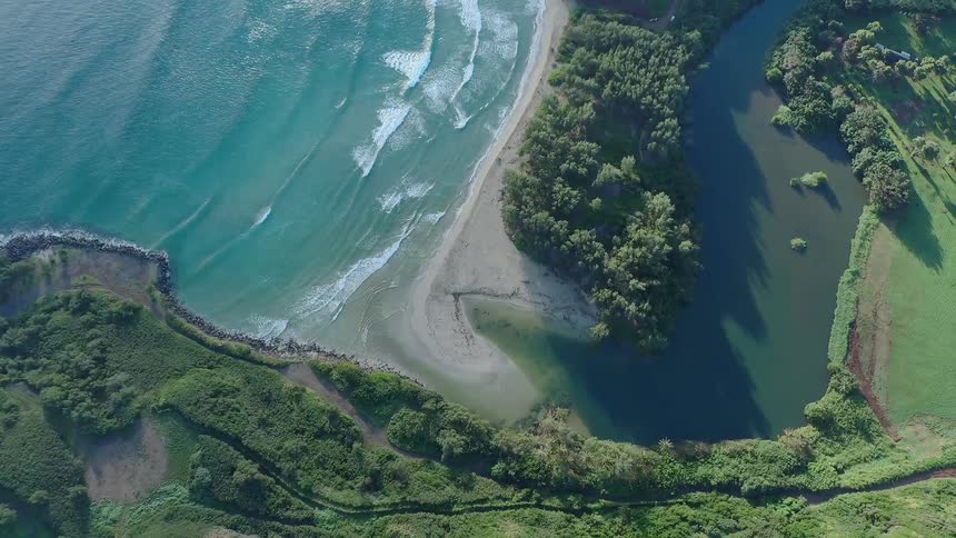 Ocean waves flow towards a coastline
