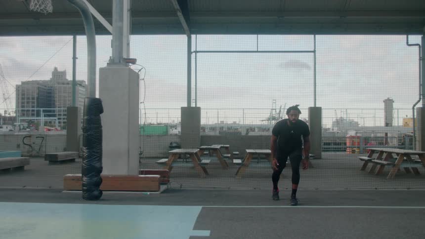 Man gets ready to run and takes off