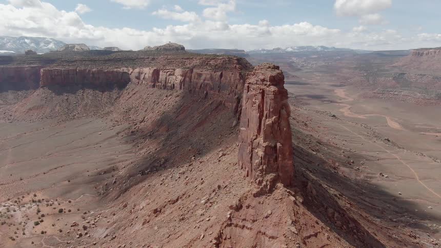Large rocky plateau with clouds overhead