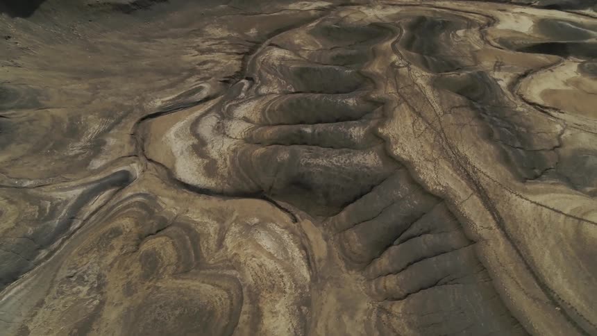 Dirt and hills cover a desert landscape