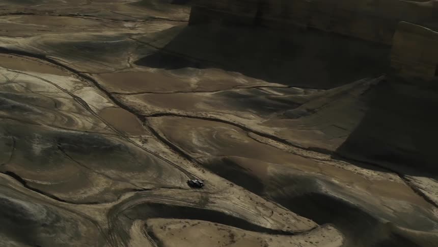 Sandy hilly desert with overcasting shadows