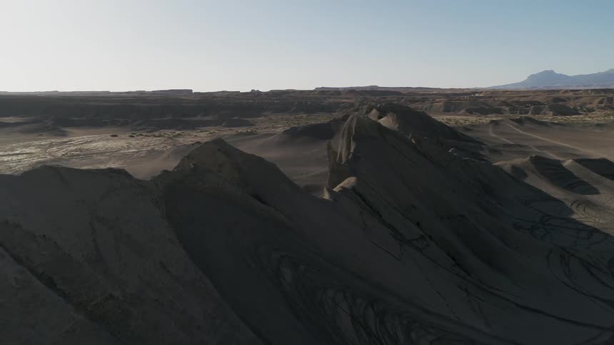 Sun shines over hilly desert