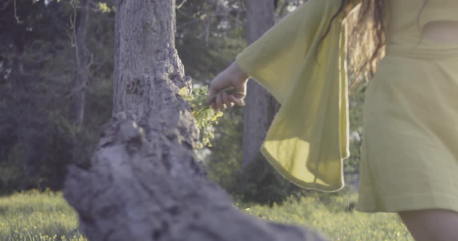 Woman walks outside with a bouquet of flowers
