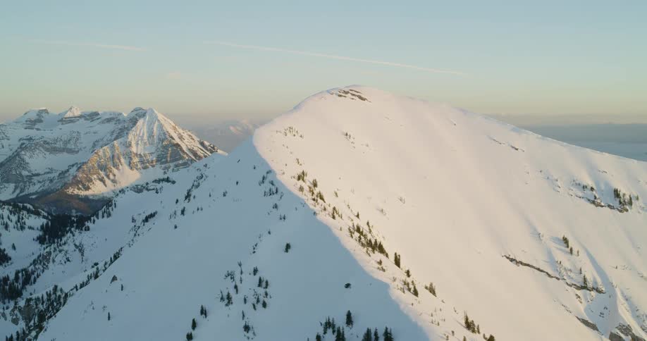 Snow covers mountains in the wilderness