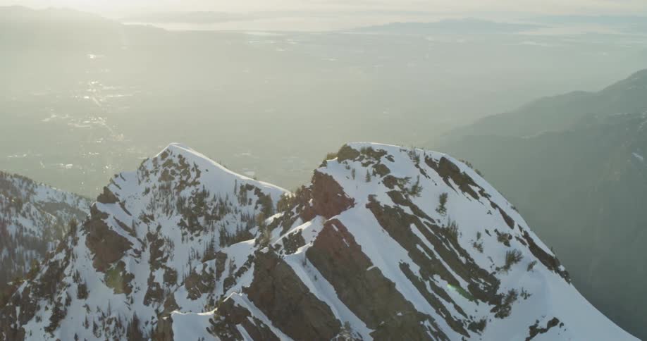 Snow covered mountain peaks on sunny day