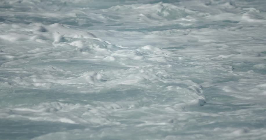 Ocean waves crashing on a sunny day