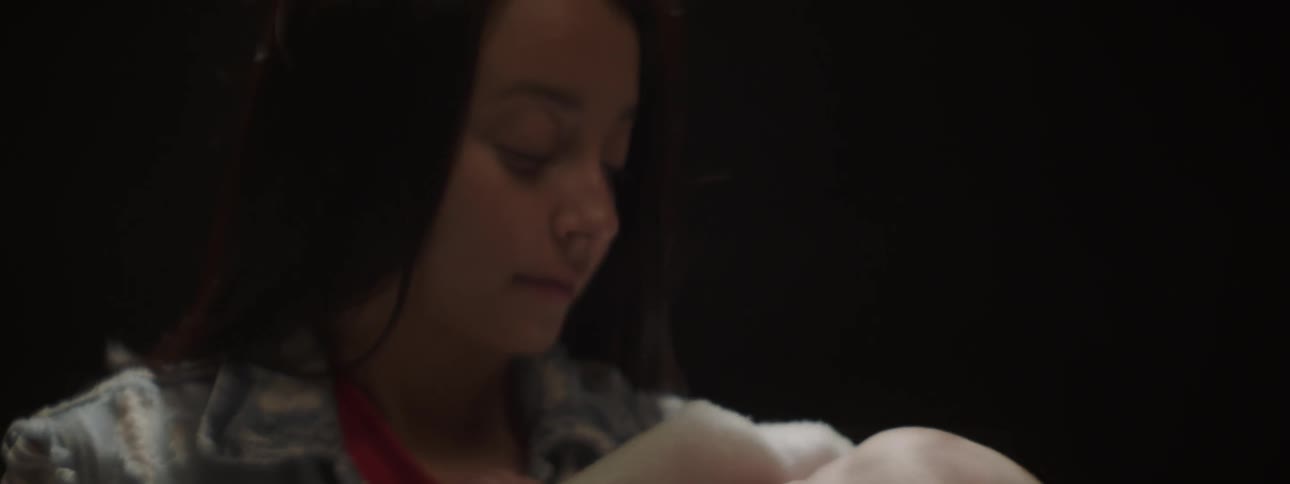 Child cuddles a baby
