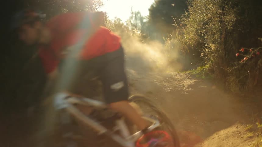 Man quickly descends a trail going down