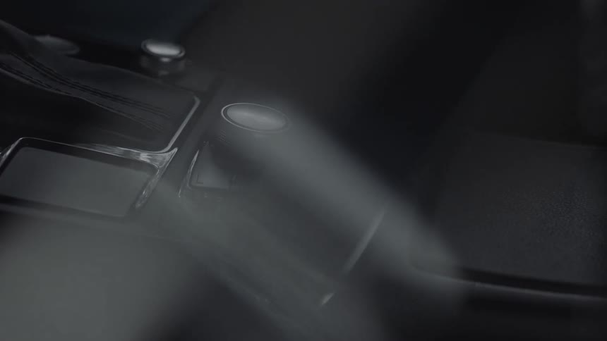 The light is reflecting on the console inside the vehicle