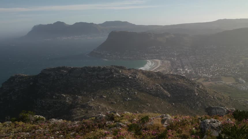 The town by the shore is surrounded by hills