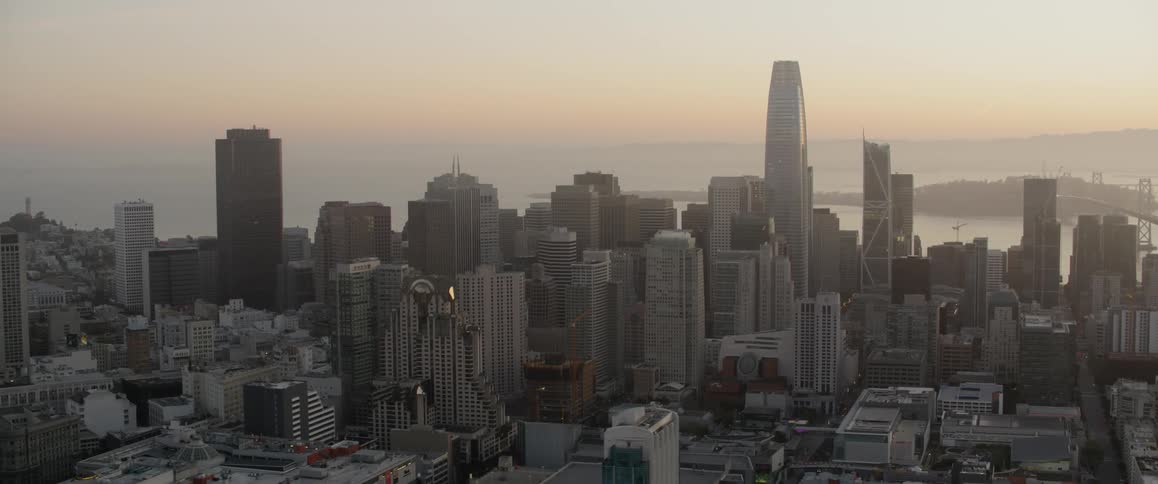 Sun sets over a large city
