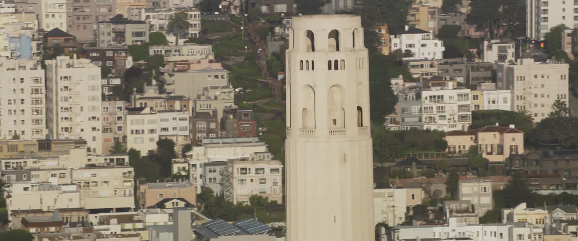 The tower rises above the city below