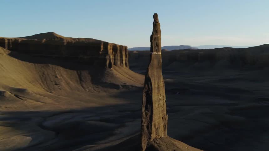 Sandy hilly desert with shadows made by the sun