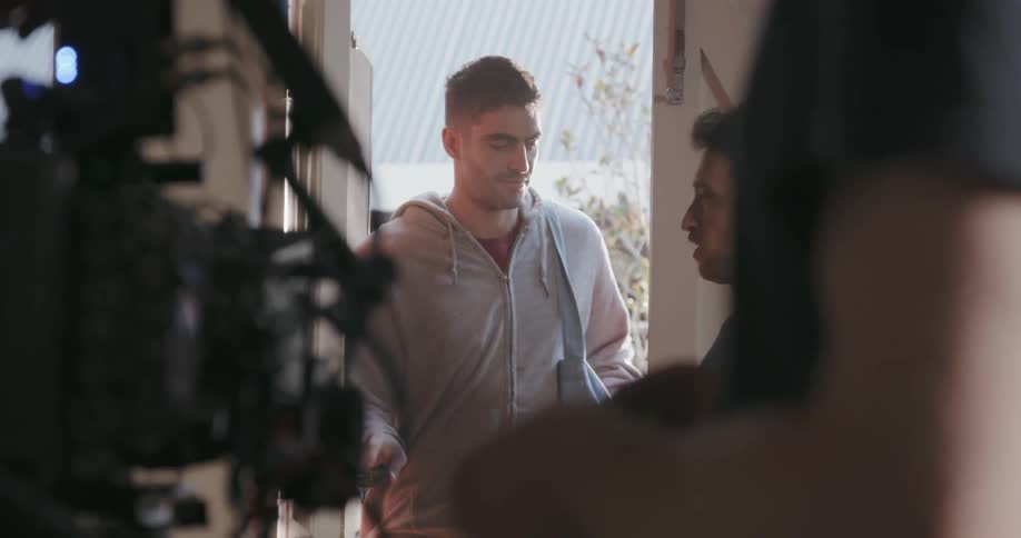 A film crew works inside a house