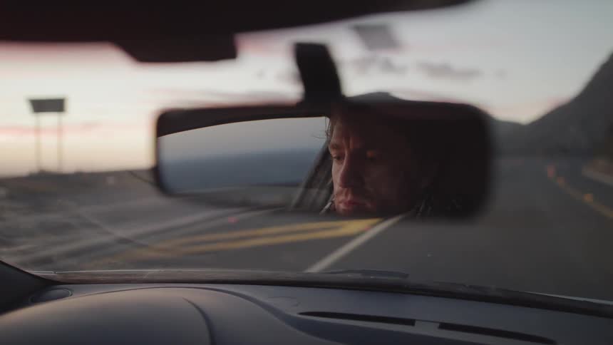 A man drives a car