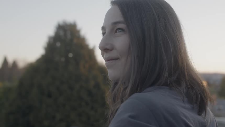 Woman standing outside is smiling