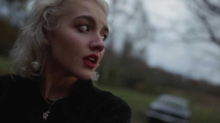 A woman cries outside
