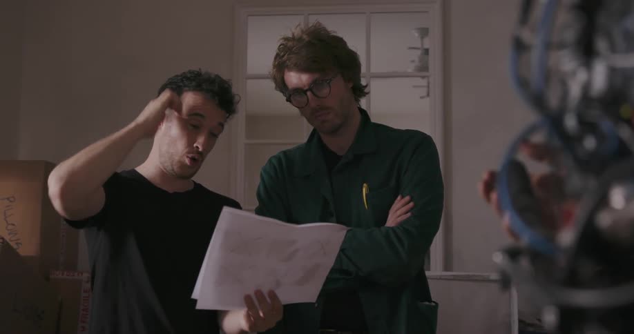 A man instructs another man