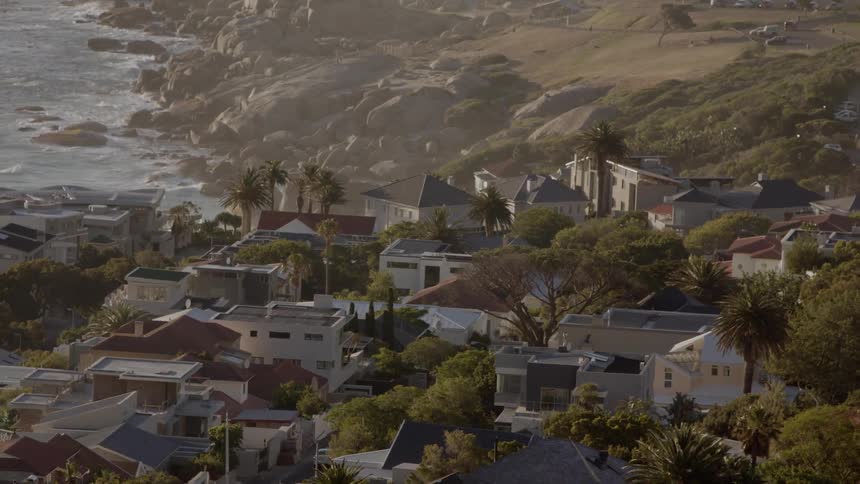 Houses cover the land by the shore