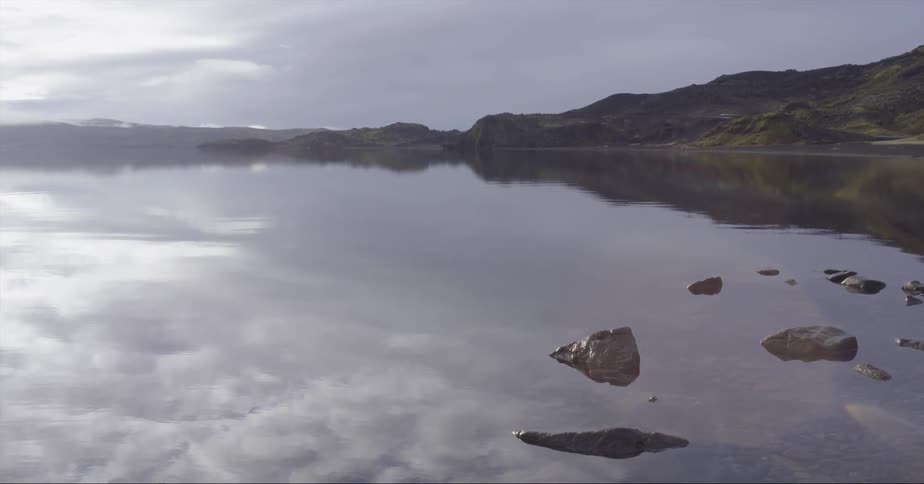 Sun shines over a still lake