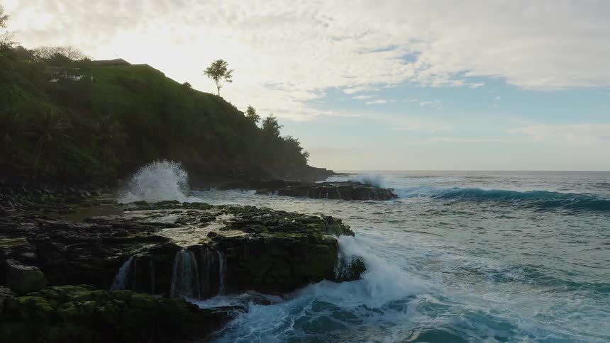 Waves crash onto the rocky shore