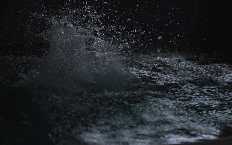 Water splashes up then falls back to the surface
