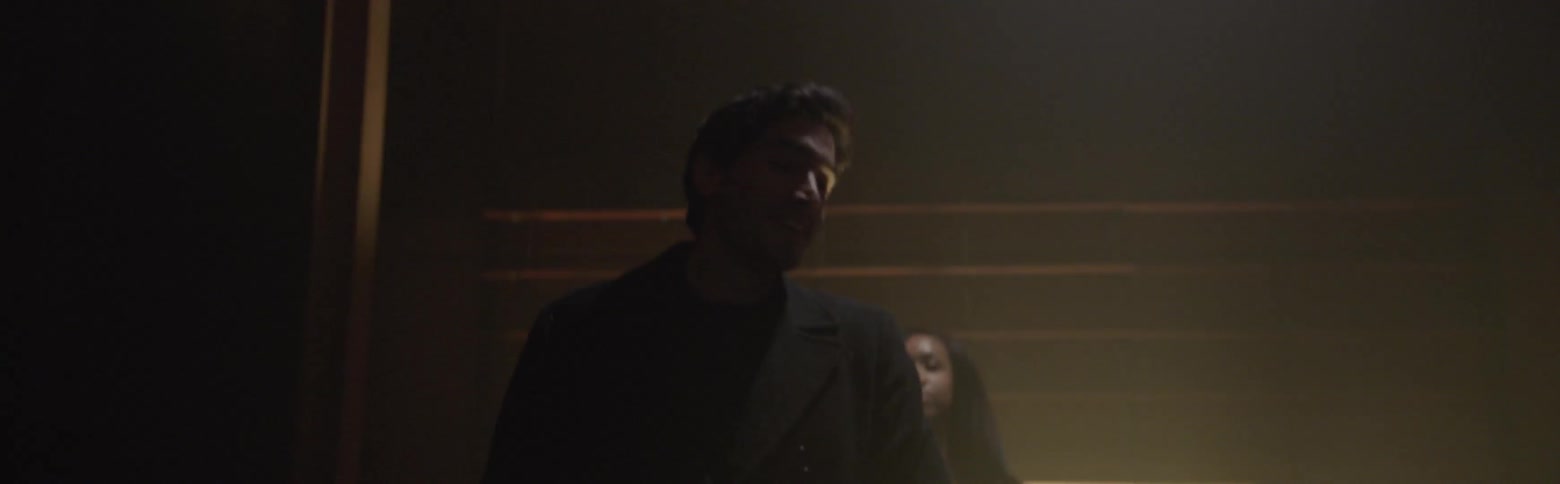 Man and woman walk up a staircase