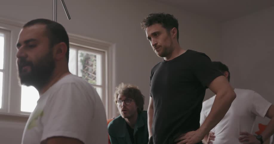 A film crew works inside a house