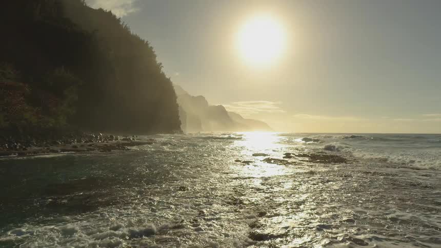 The sun sets over a beach