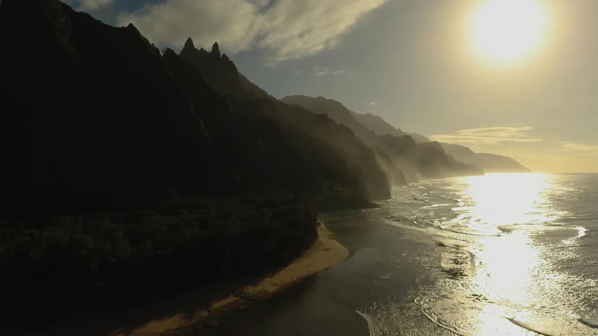 The sun is setting on the shore
