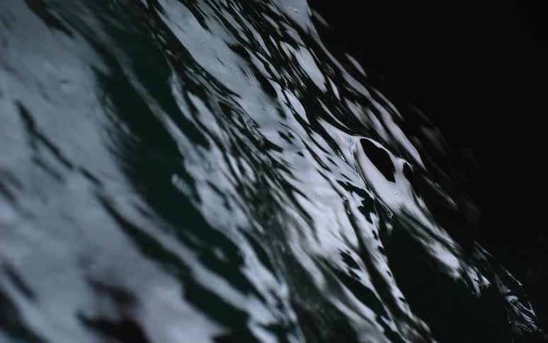 Water ripples in a dark area