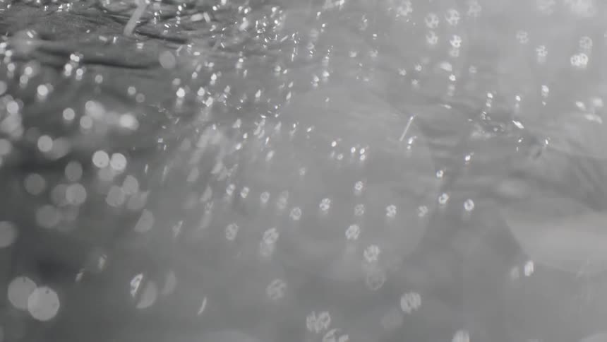 Water falls into a pool and splashes
