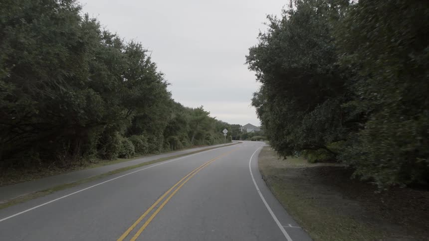 Highway sits with trees on each side