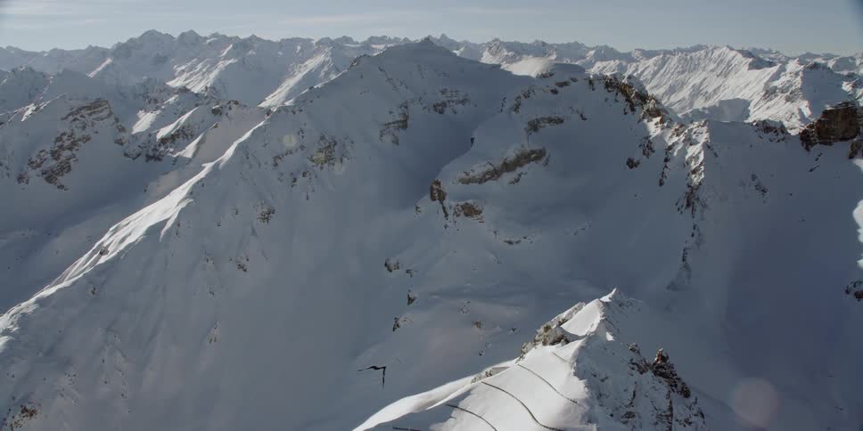 Snow covers the mountainous landscape