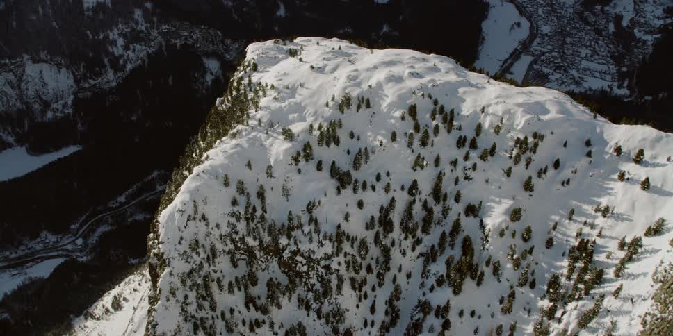 Snow covers the top of the mountain