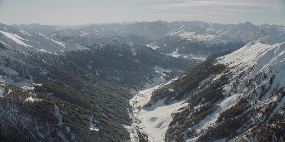 Sunlight shines on snowy mountains