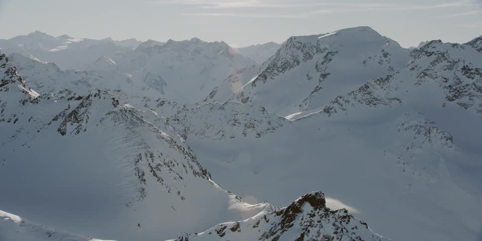 Snow covers the mountainous landscape