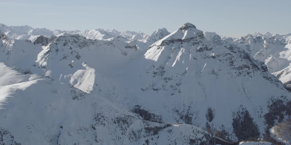 Sun shines over snowy mountains